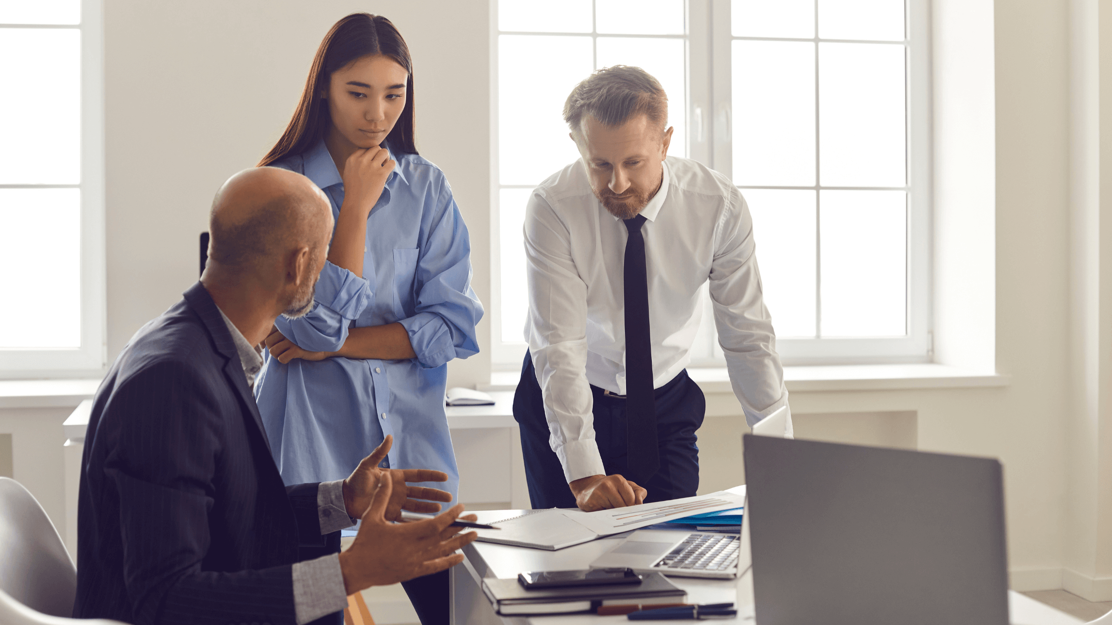 Banker consulting with businesspeople